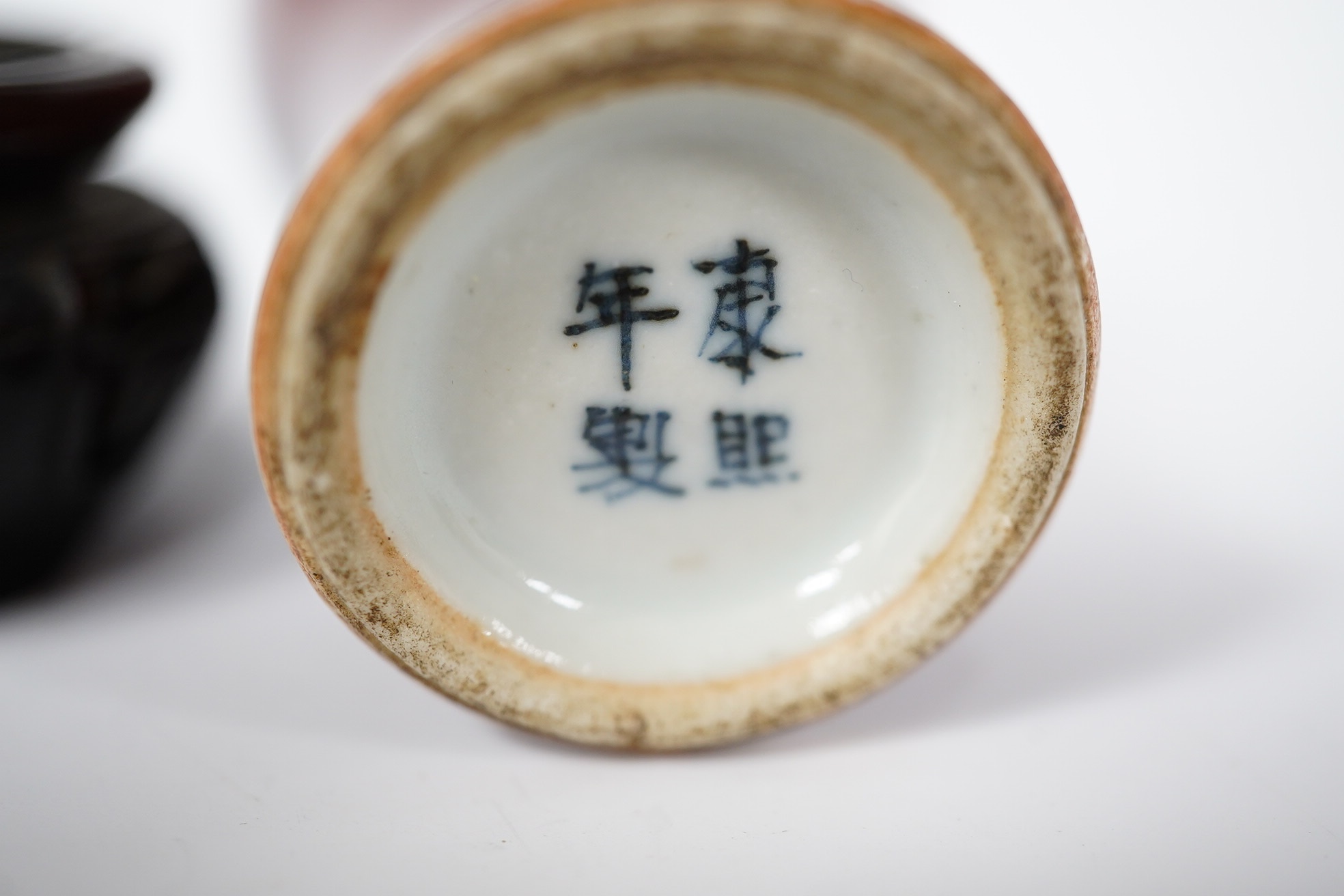A Chinese Langyao snuff bottle, Kangxi mark, late 19th century, with hardwood stand, overall 10cm high. Condition - good, some crazing